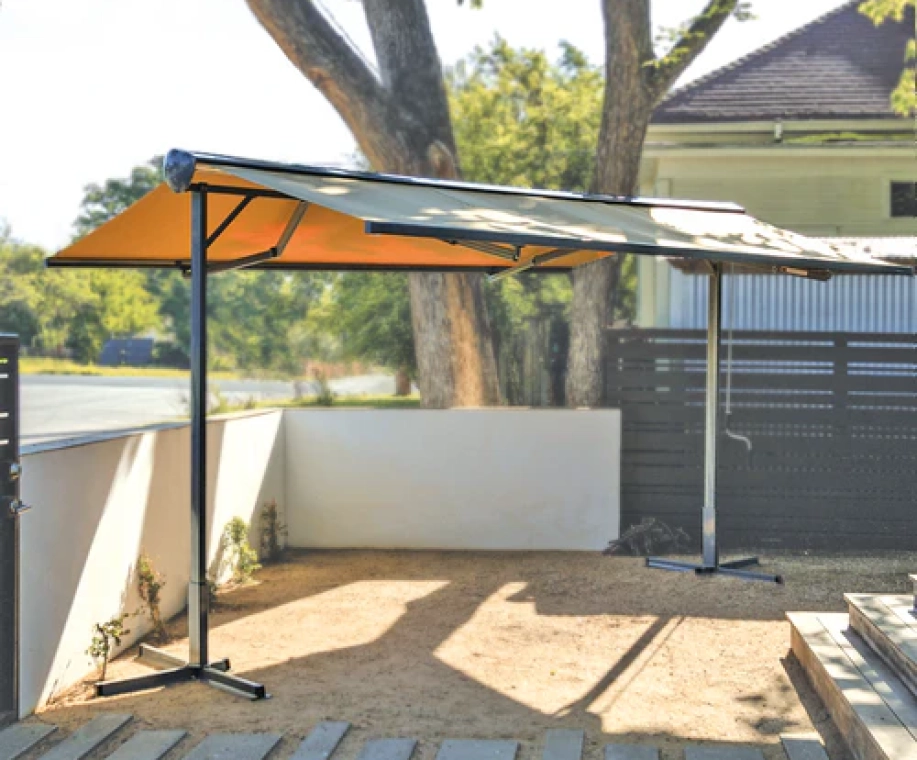 Free-standing awning system for flexible outdoor shade without wall mounting.