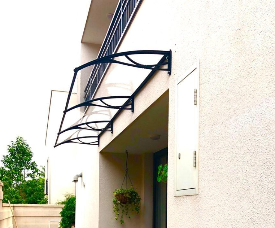 Solid polycarbonate awning for doors and windows